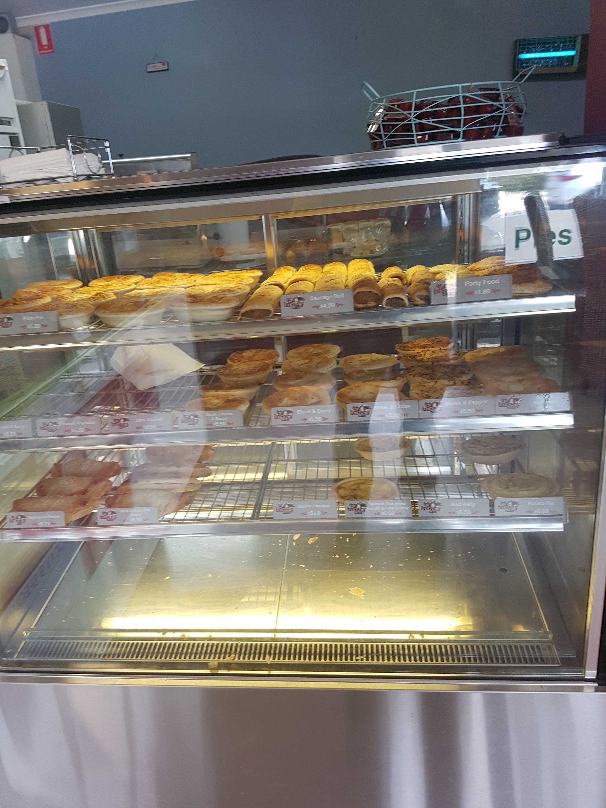 The pie warmer at Skipton Street Bakery stacked with pies, pasties and sausage rolls